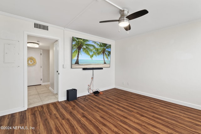 unfurnished room featuring ceiling fan, crown molding, and wood-type flooring