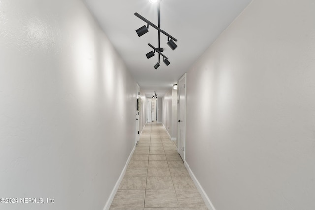 hallway featuring light tile patterned floors