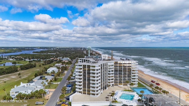 bird's eye view with a water view and a view of the beach