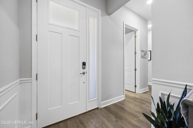 foyer entrance with hardwood / wood-style floors