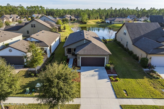 birds eye view of property featuring a water view