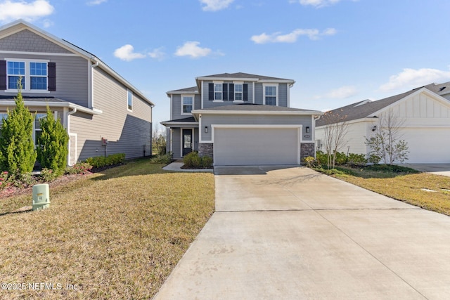 view of front of home featuring a front yard and a garage