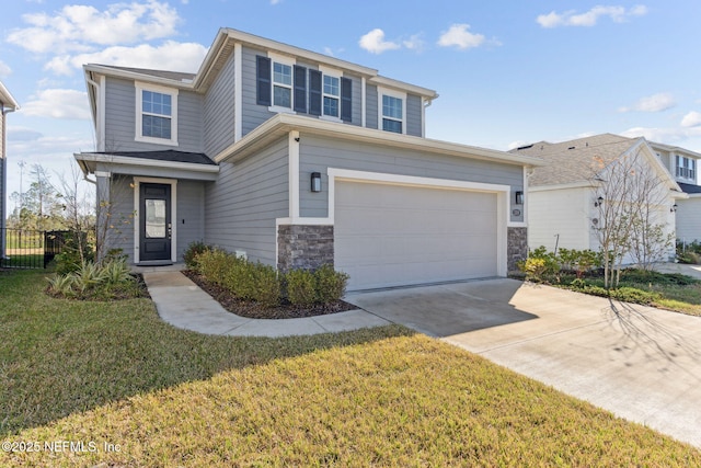 view of front of house with a front yard and a garage