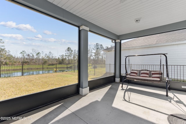 sunroom with a water view