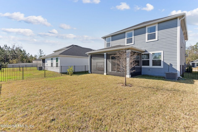 back of house featuring a yard, central AC unit, and a sunroom