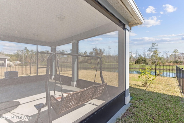 exterior space with a water view and a patio