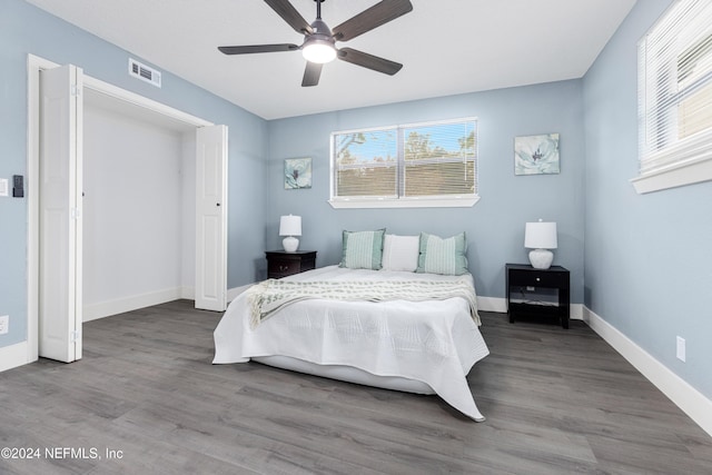 bedroom with hardwood / wood-style flooring and ceiling fan