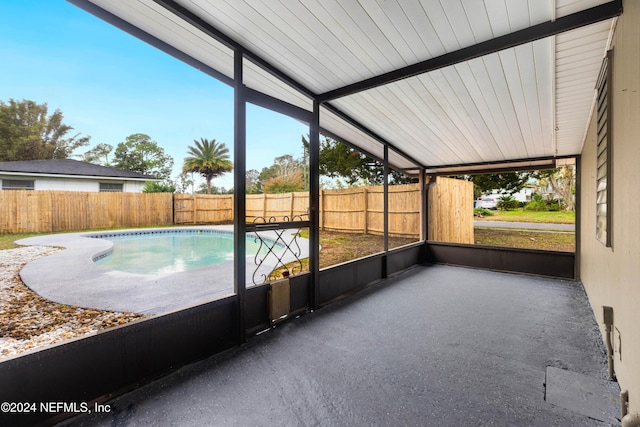 unfurnished sunroom with lofted ceiling