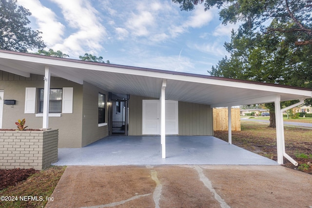 view of vehicle parking with a carport