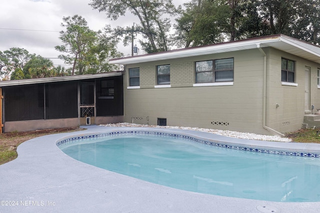 back of property featuring a sunroom