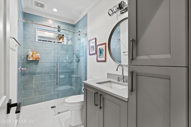 bathroom with an enclosed shower, vanity, and toilet