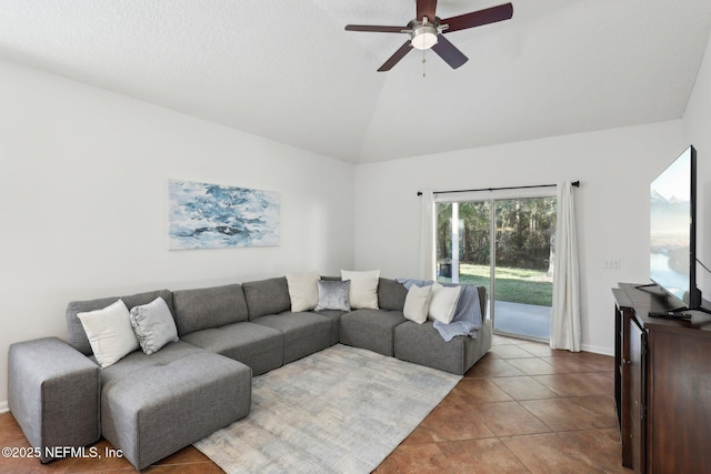 tiled living room with ceiling fan and lofted ceiling