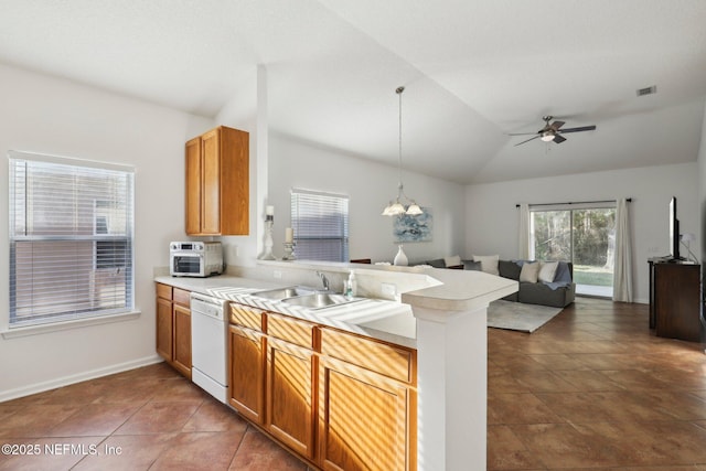 kitchen with dishwasher, sink, hanging light fixtures, kitchen peninsula, and vaulted ceiling