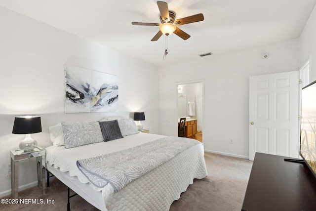 bedroom featuring carpet, ensuite bathroom, and ceiling fan