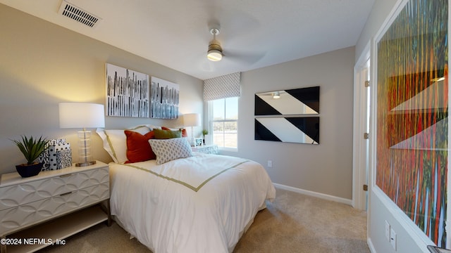 bedroom featuring light colored carpet and ceiling fan