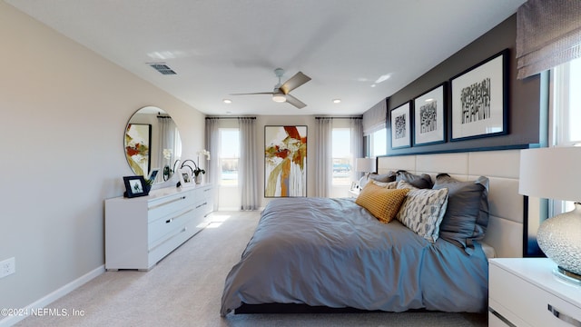 carpeted bedroom with ceiling fan