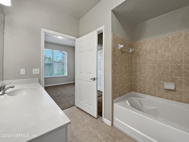 bathroom with vanity, tile patterned floors, and tiled shower / bath