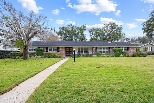 single story home with a front yard