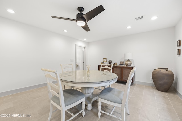 tiled dining room featuring ceiling fan