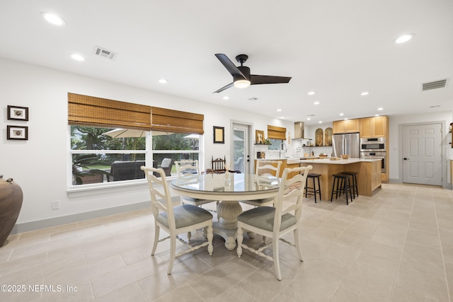 dining room featuring light tile patterned floors and ceiling fan