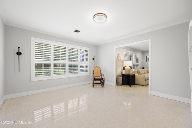 living area with ornamental molding