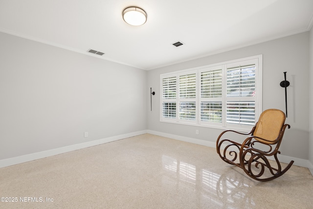 living area with crown molding