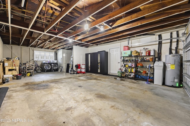 garage featuring a workshop area and electric water heater