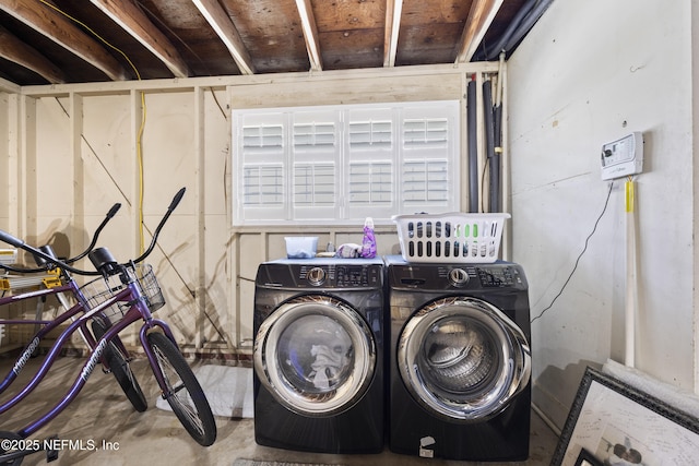 washroom with washing machine and clothes dryer