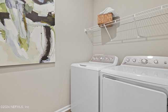 laundry room with separate washer and dryer