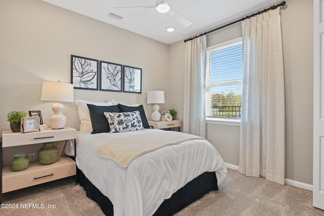 carpeted bedroom with ceiling fan