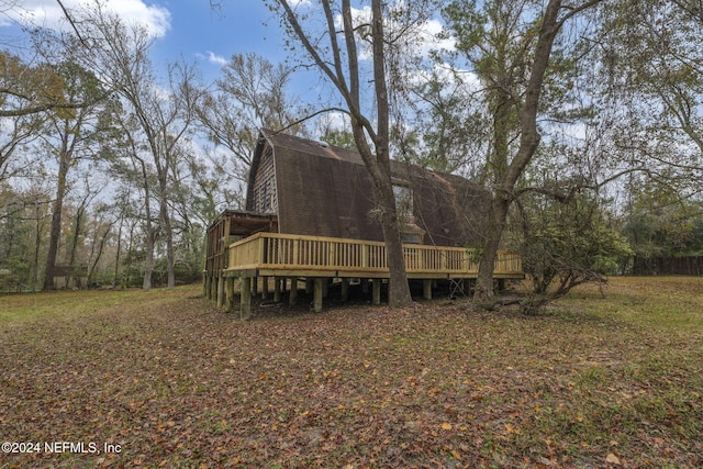 back of property with a deck