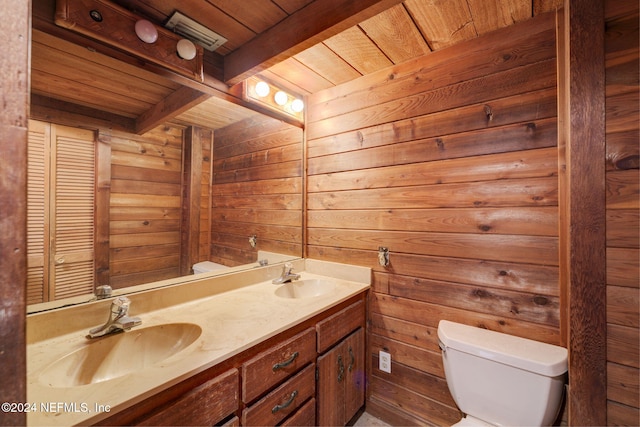 bathroom featuring vanity, beamed ceiling, wooden ceiling, and toilet