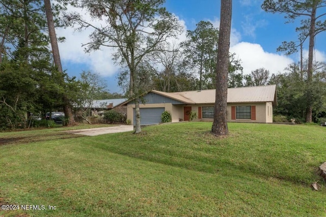 view of front facade featuring a garage and a front lawn