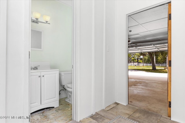 bathroom with vanity and toilet