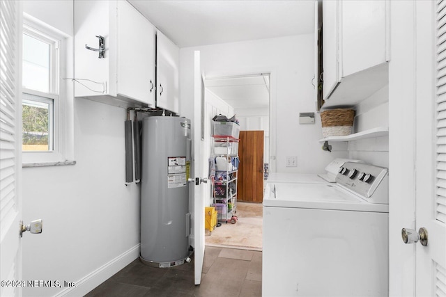 laundry area featuring separate washer and dryer, water heater, and cabinets