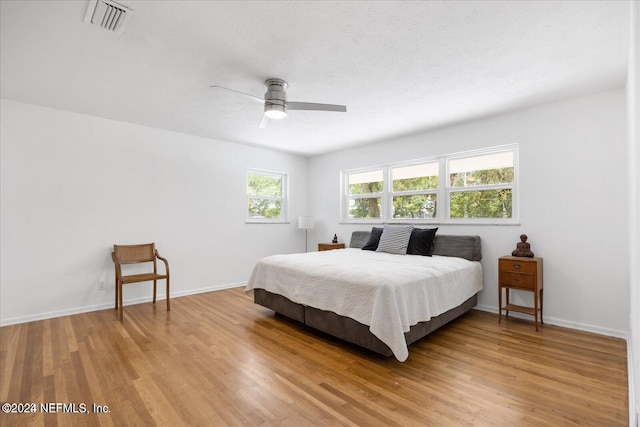 bedroom featuring ceiling fan and hardwood / wood-style floors