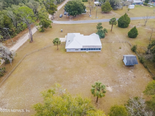 birds eye view of property featuring a rural view