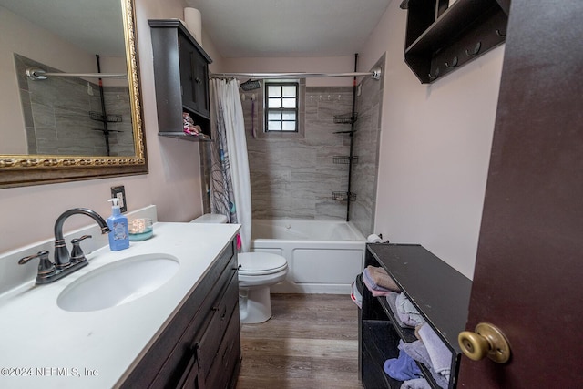 bathroom featuring shower / tub combo with curtain, vanity, toilet, and wood finished floors