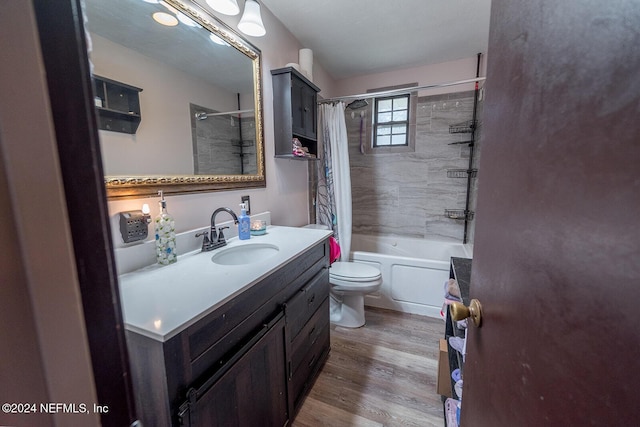 bathroom with shower / bath combo, vanity, toilet, and wood finished floors