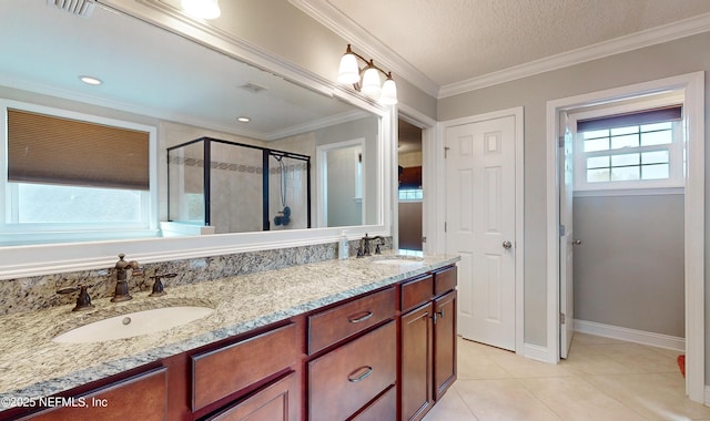 bathroom featuring an enclosed shower, a textured ceiling, vanity, crown molding, and tile patterned flooring