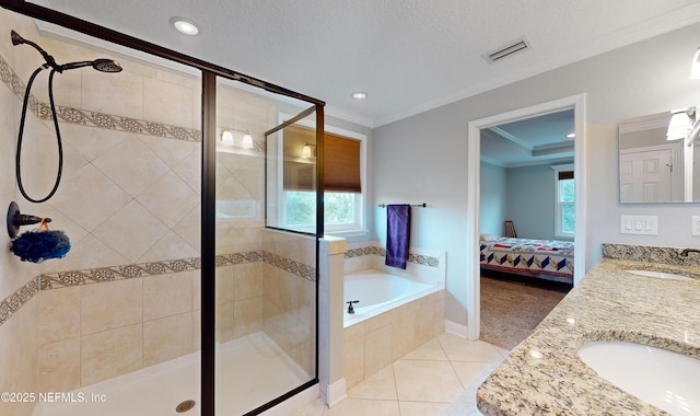 bathroom with vanity, a textured ceiling, separate shower and tub, crown molding, and tile patterned flooring