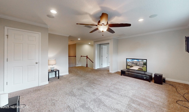 living room with carpet flooring, ceiling fan, and crown molding