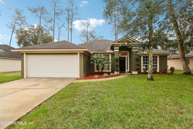 view of front facade featuring a garage and a front lawn