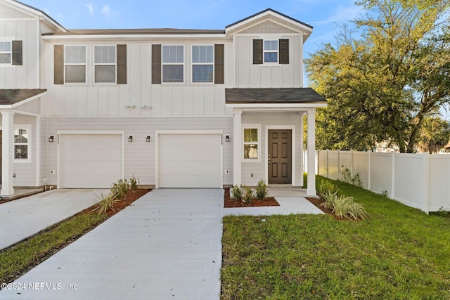 view of front of house featuring a garage and a front lawn