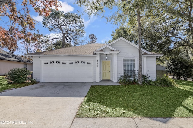 ranch-style home featuring a front yard and a garage