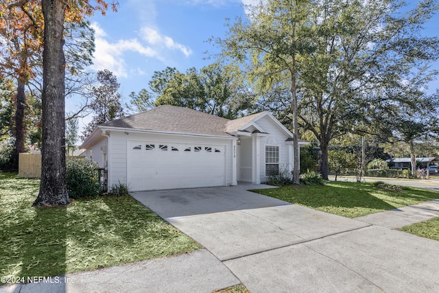 view of front facade featuring a garage and a front lawn