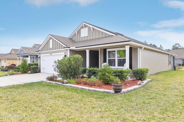 view of front of house with a front yard and a garage