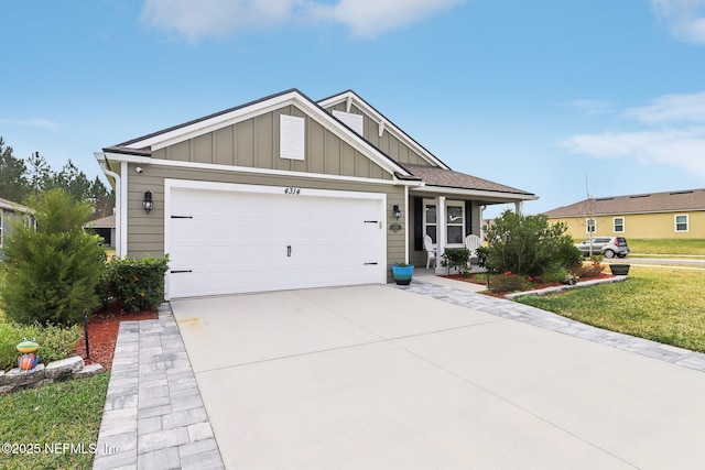 view of front of home with a front yard and a garage