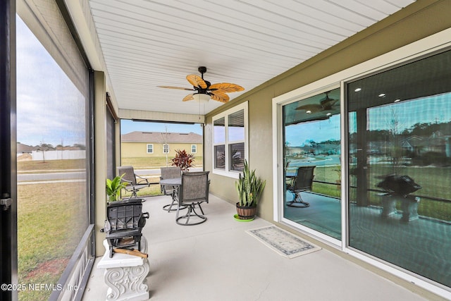 sunroom / solarium with ceiling fan