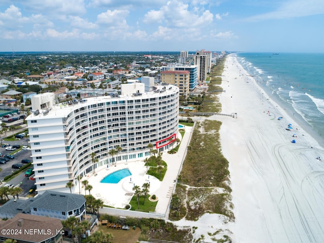 drone / aerial view with a water view and a view of the beach